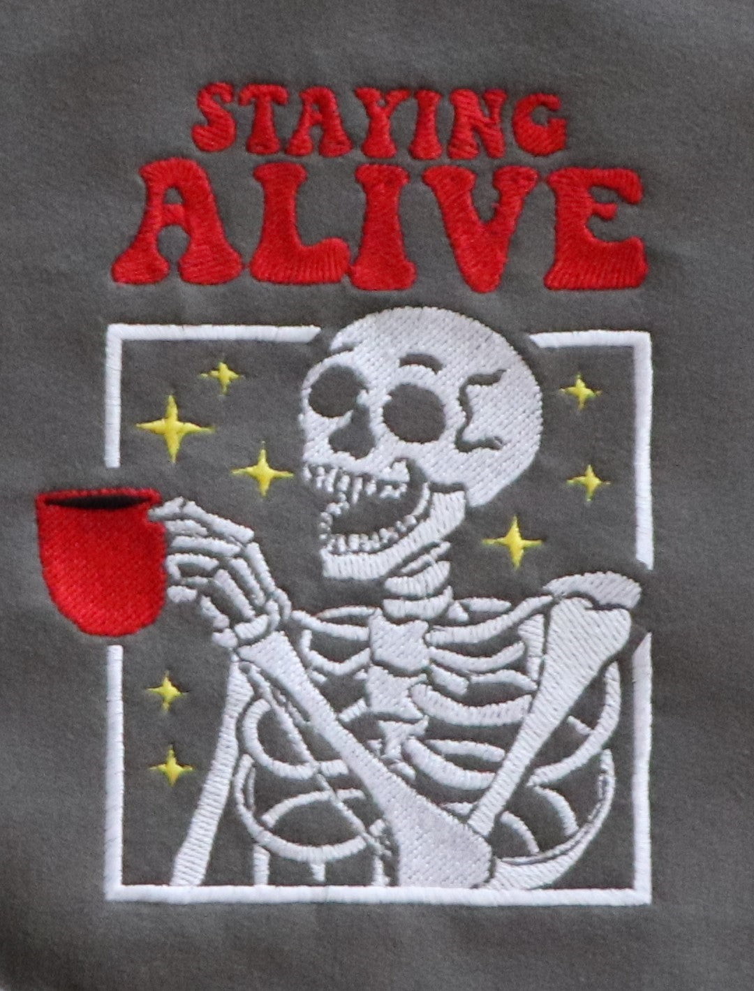EMBROIDERED SWEATSHIRT- STAYING ALIVE COFFEE AND SKELETON